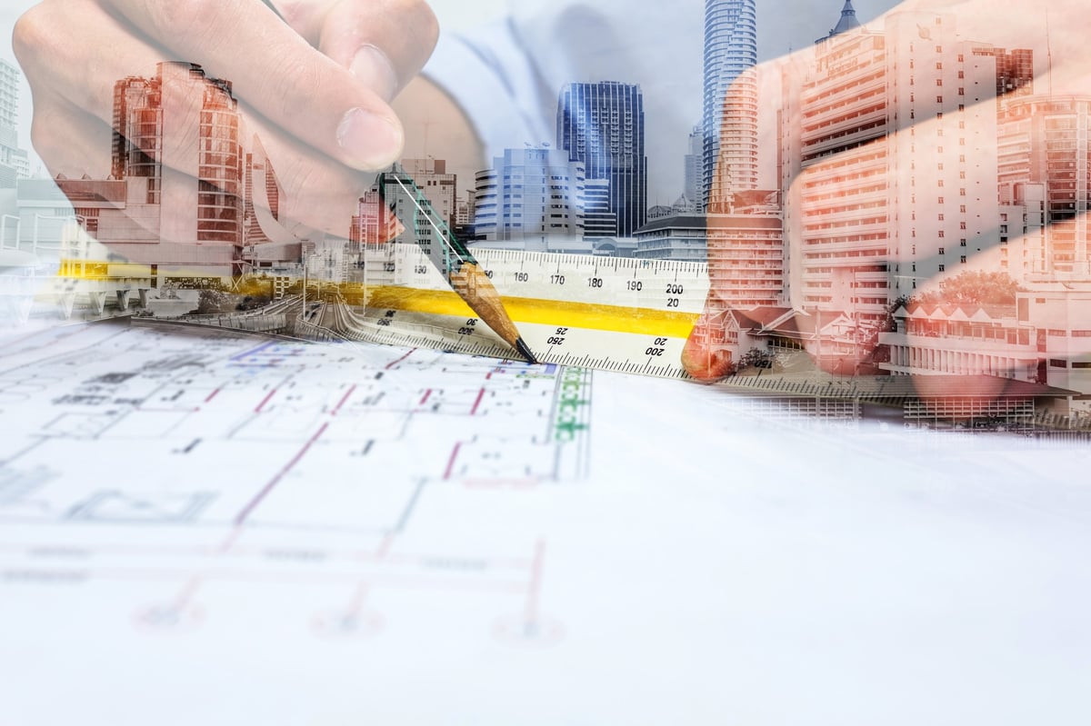 Quantity surveyor working on construction plans