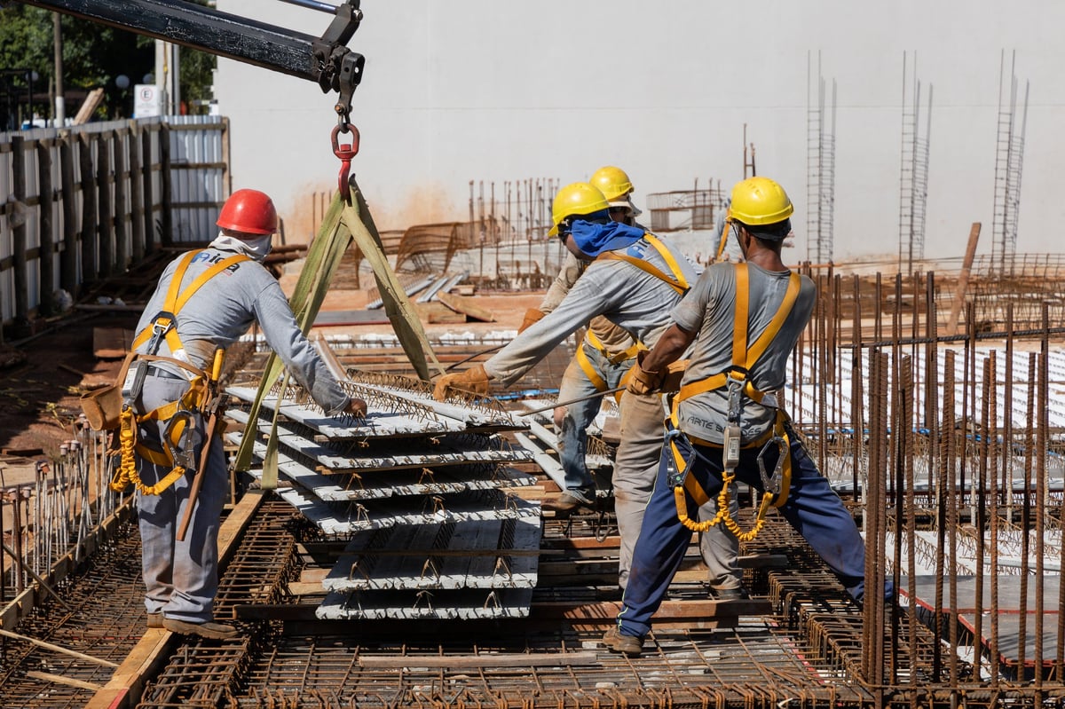 Construction workers building house in Uganda