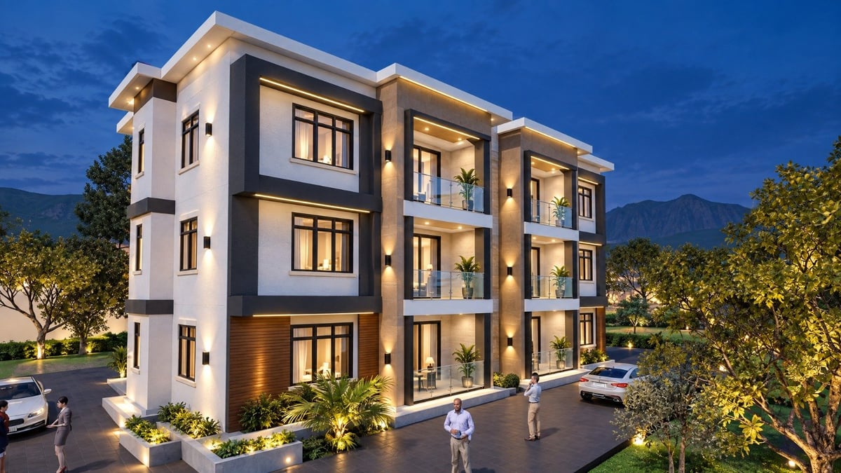 Modern three-story apartment building at dusk with illuminated windows, landscaping, and parked cars in front